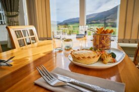 Meal at Glen Clova Hotel restaurant with views of the glens