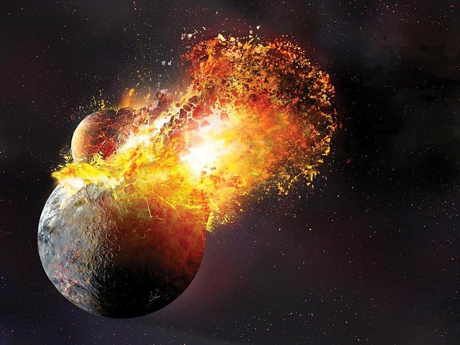 An artistic rendering of a planetary collision in space. A large, dark-colored planet is being struck by a smaller one, creating a massive explosion of bright orange and yellow fire, debris, and light. The background is a dark starry sky.